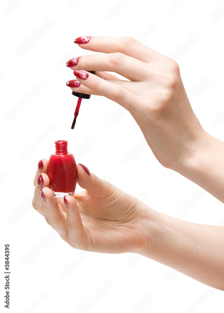 涂有红色油漆的女人的手。隔离在白色上。
