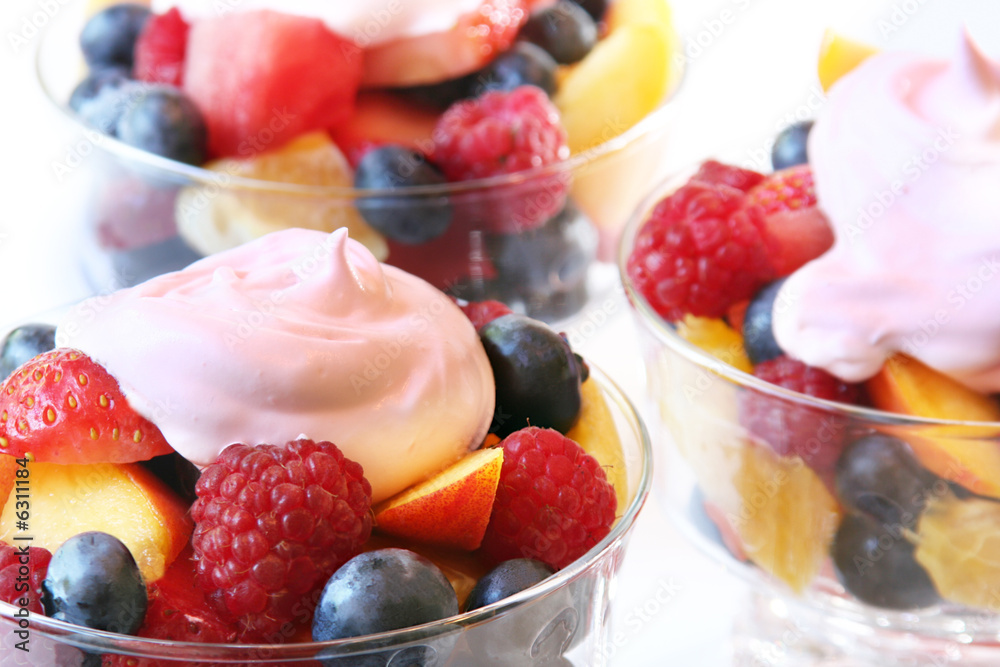 Summer fruit salad, fresh fruit and strawberry yogurt topping.