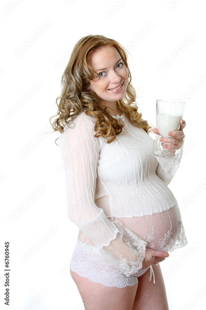 Beautiful pregnant woman with milk
