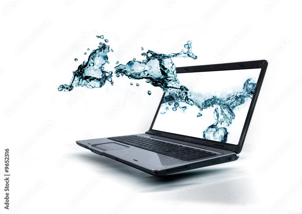 A notebook with water splashing out of the monitor.