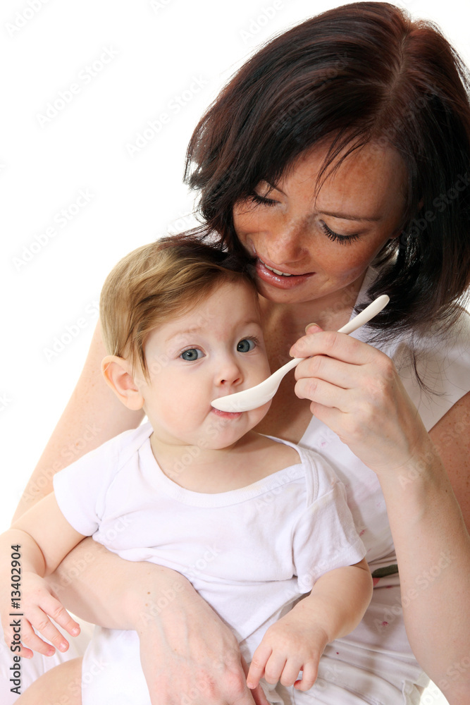 Mother feeding hungry baby
