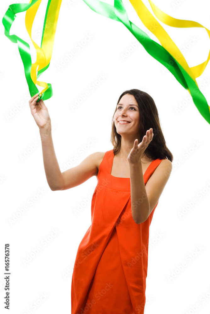 Woman in vivid color dress play with flying ribbon