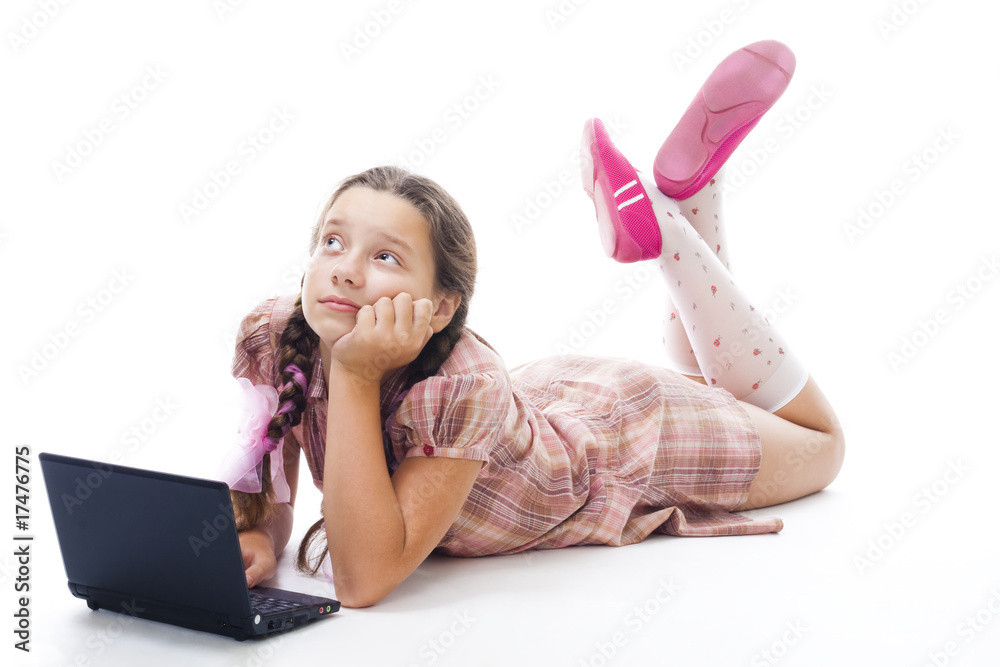 Teenager girl with laptop thinking laying