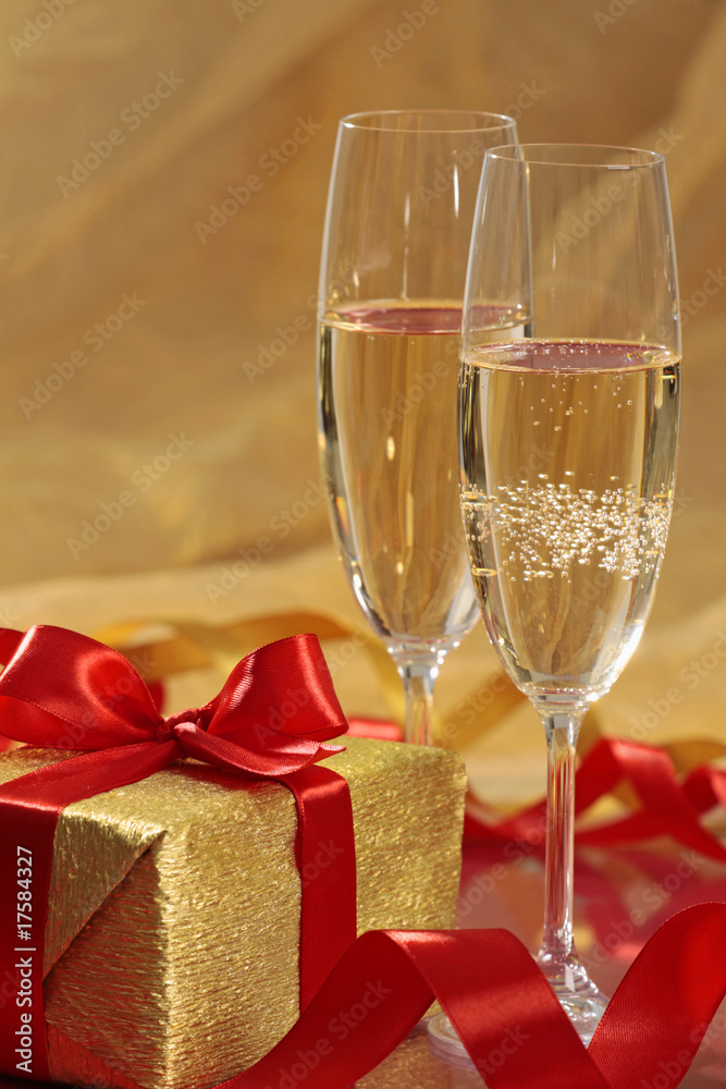 gift and glasses of champagne