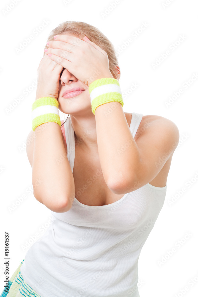 Woman close eyes with hands wearing sports wear