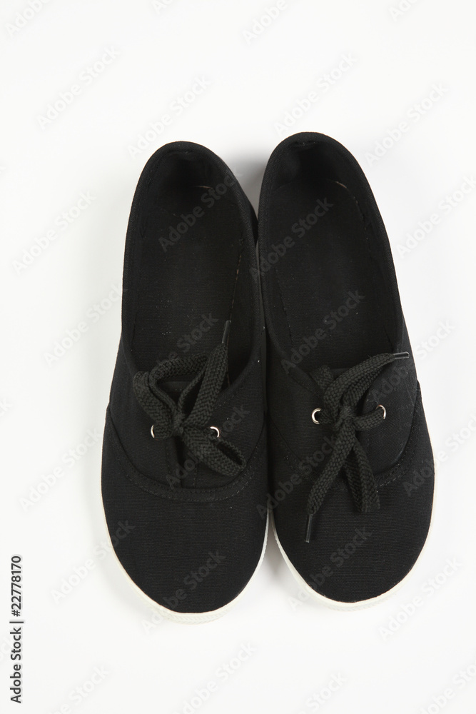 a pair of black women shoes and white background