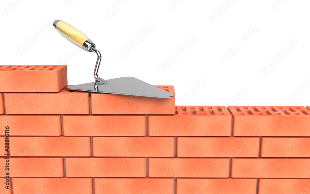 Trowel and bricks wall construction