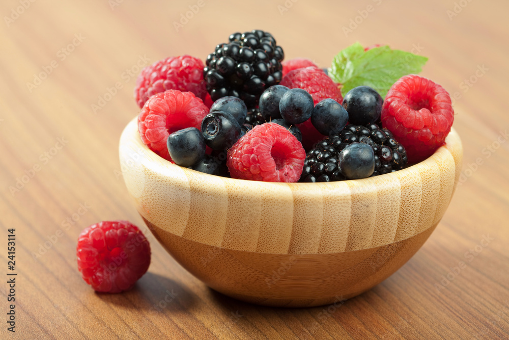 fresh berries in wood bowl