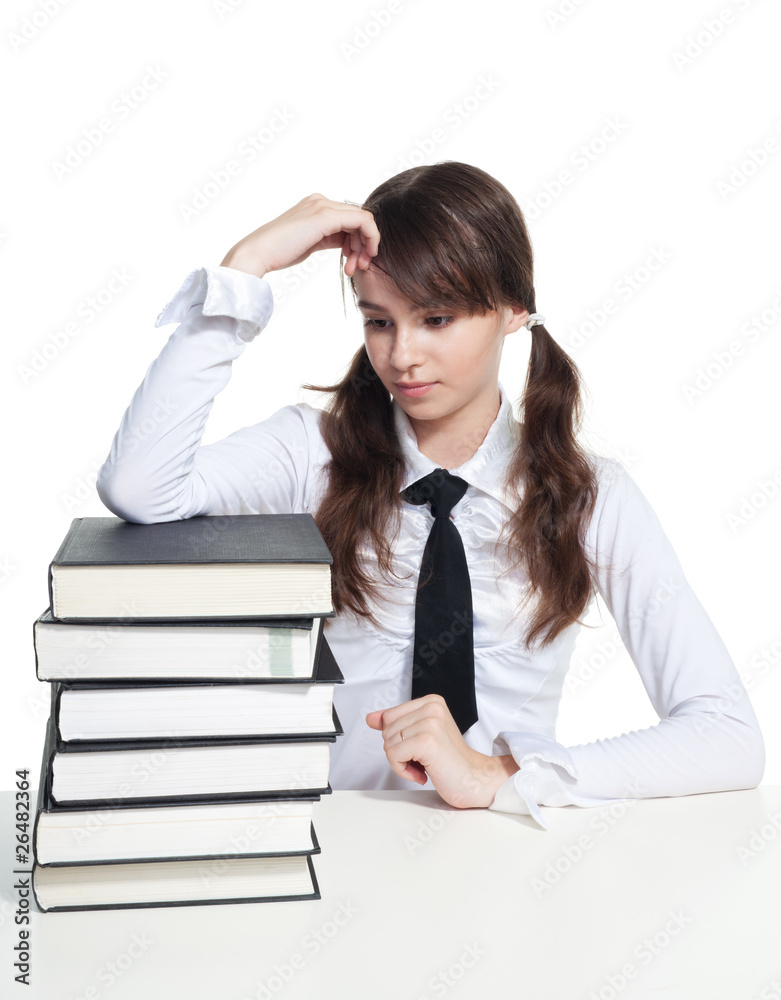 Sad schoolgirl with books