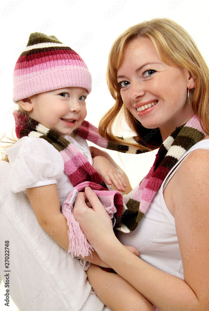 Mother with Baby girl in winter wool hat and scarf