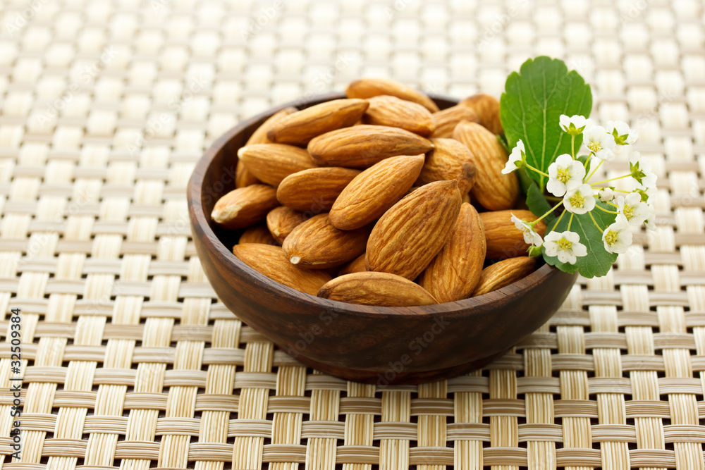Almonds in wooden bowl