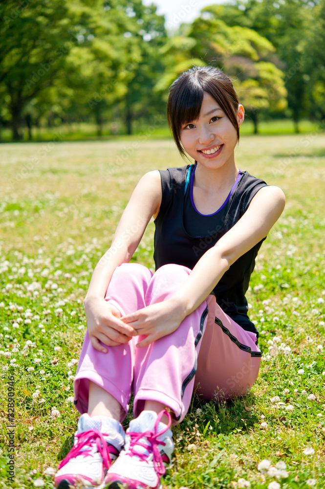 beautiful asian woman sitting in the park