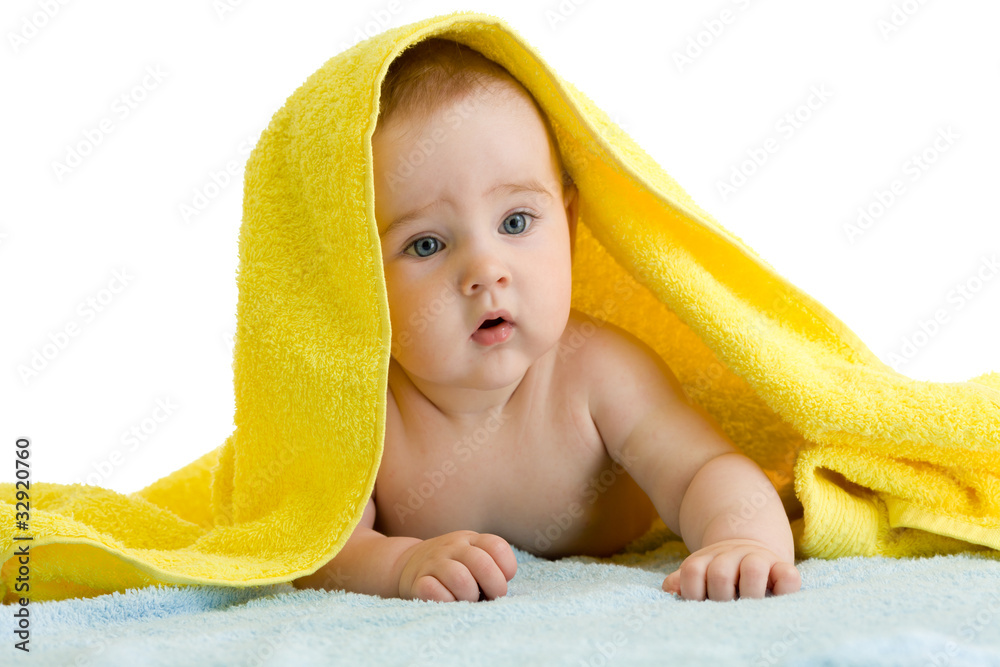 Adorable baby in colorful towel