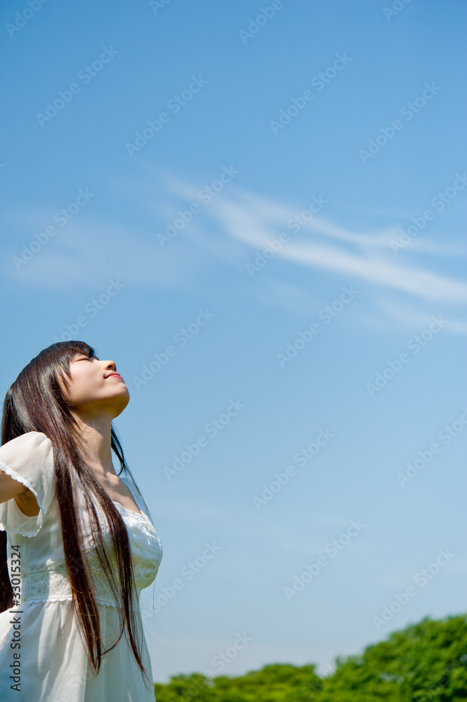 beautiful asian woman looking sky