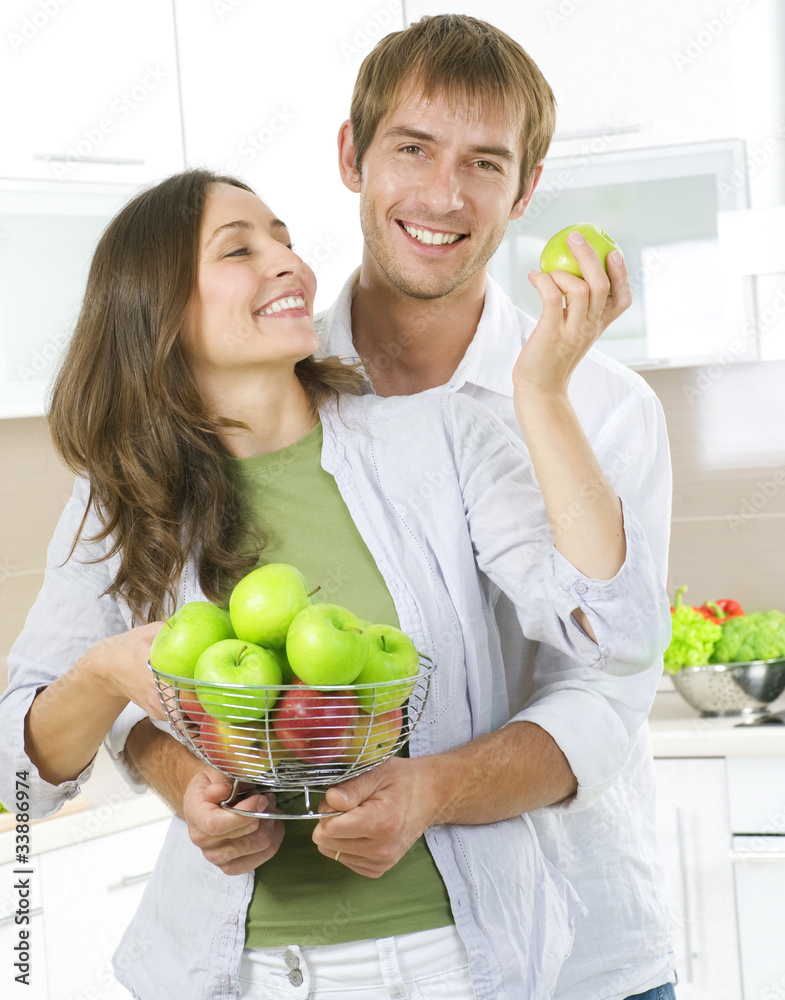 Lovely Sweet Couple eating fresh fruits. Healthy food. Diet