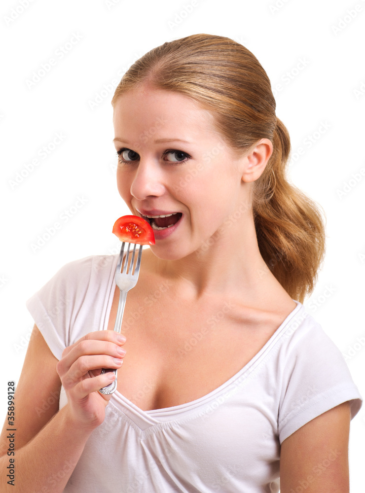 Girl eats tomato