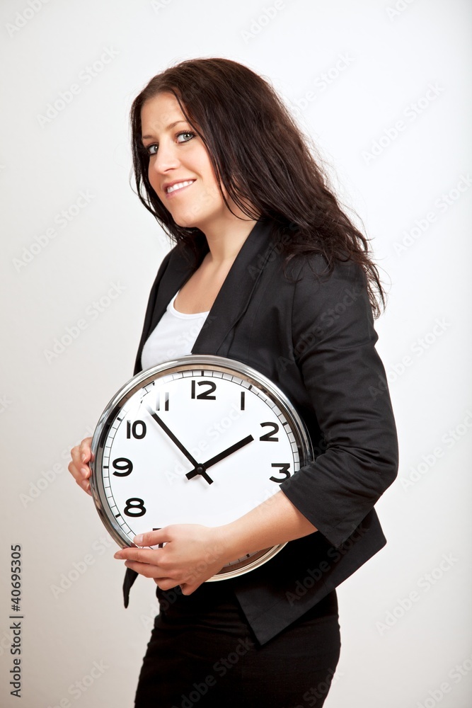 A Confident Woman Holding a Clock