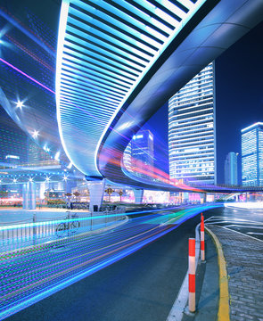 Megacity Highway at rainbow night with light trails in shanghai