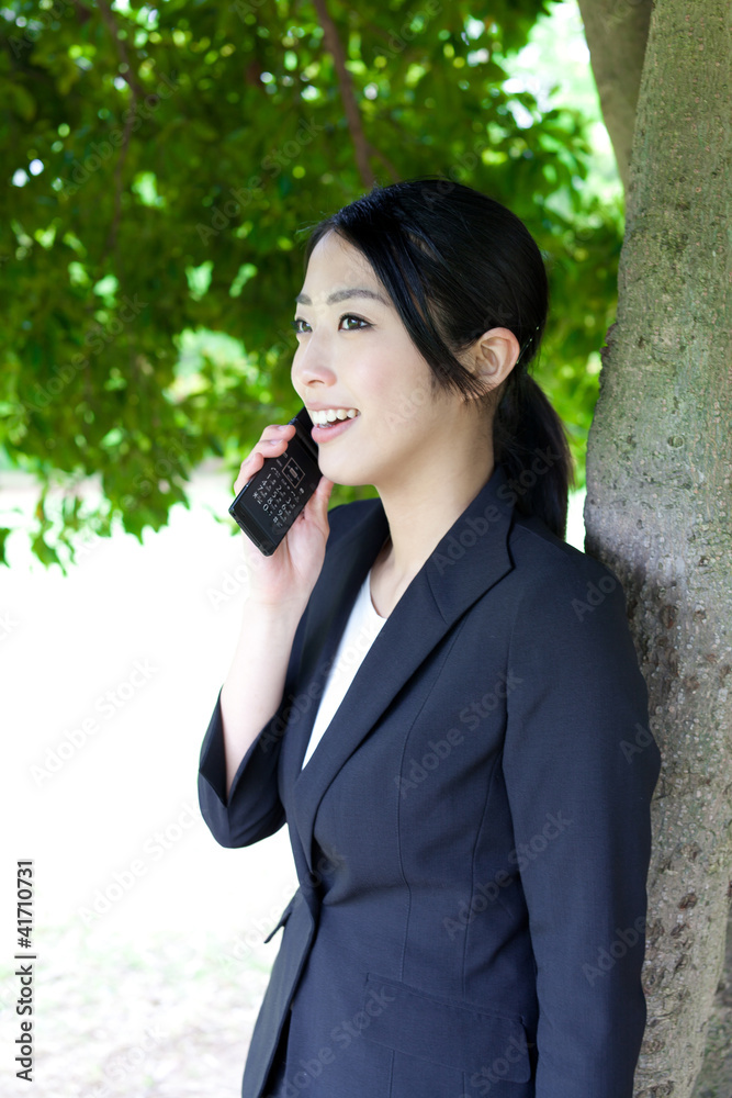 asian businesswoman working in the park