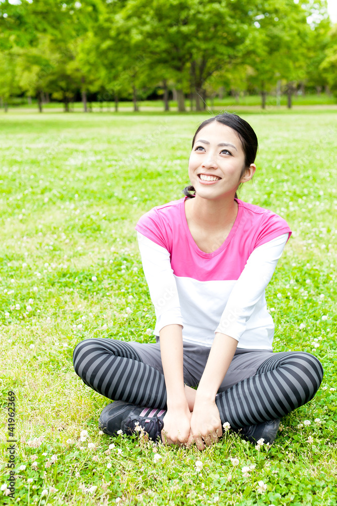 young asian woman relaxing in the park
