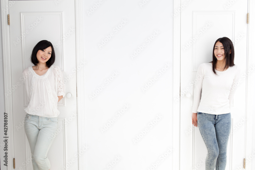 a young asian women with 2 doors
