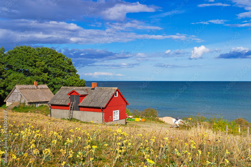 Traditional red Swedish cottage house at Baltic Sea
