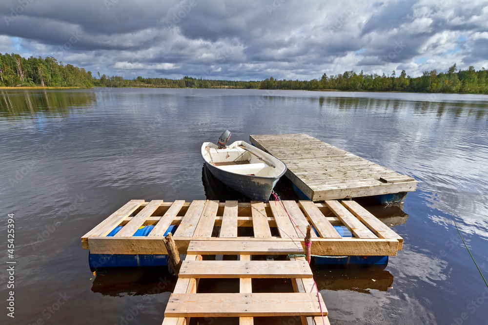 Swedish lake with boat in summer time