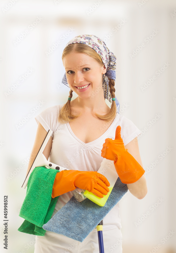Happy housewife shows a thumb up