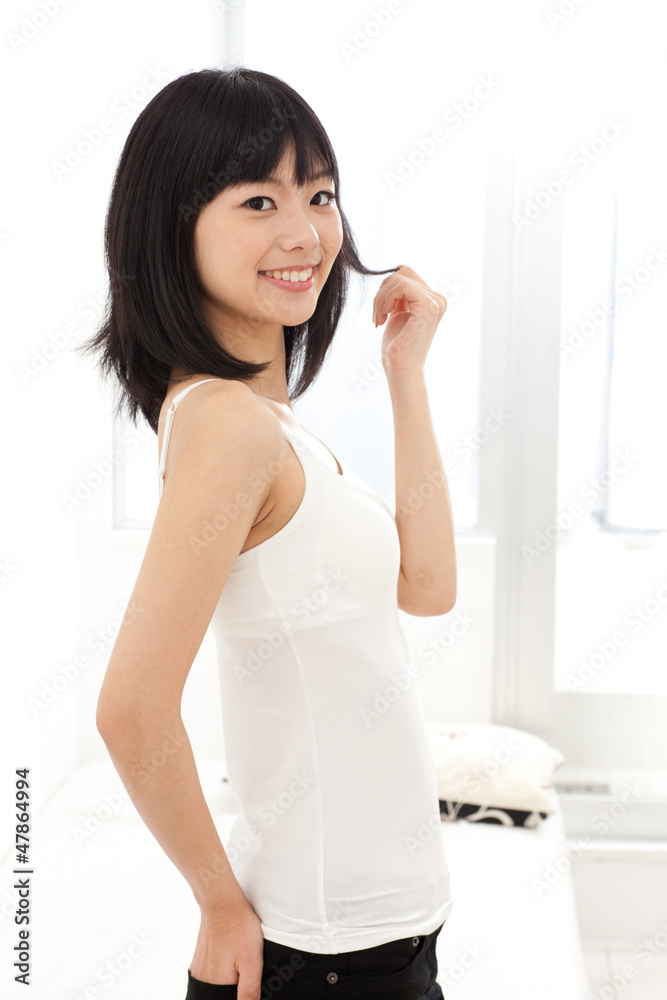 attractive asian woman relaxing in the room