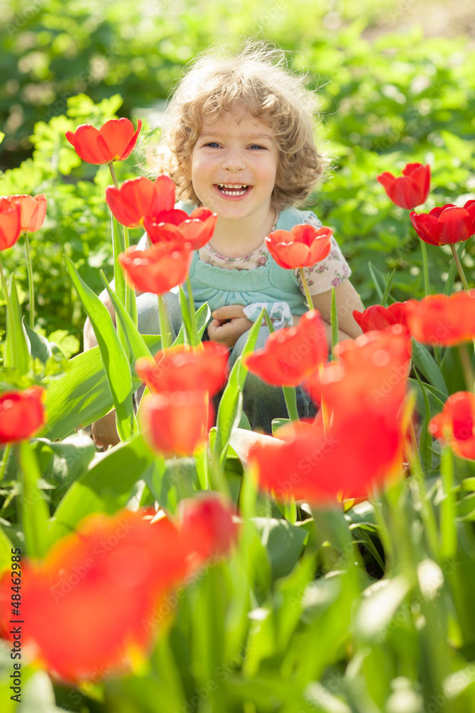 Child in flowery garden