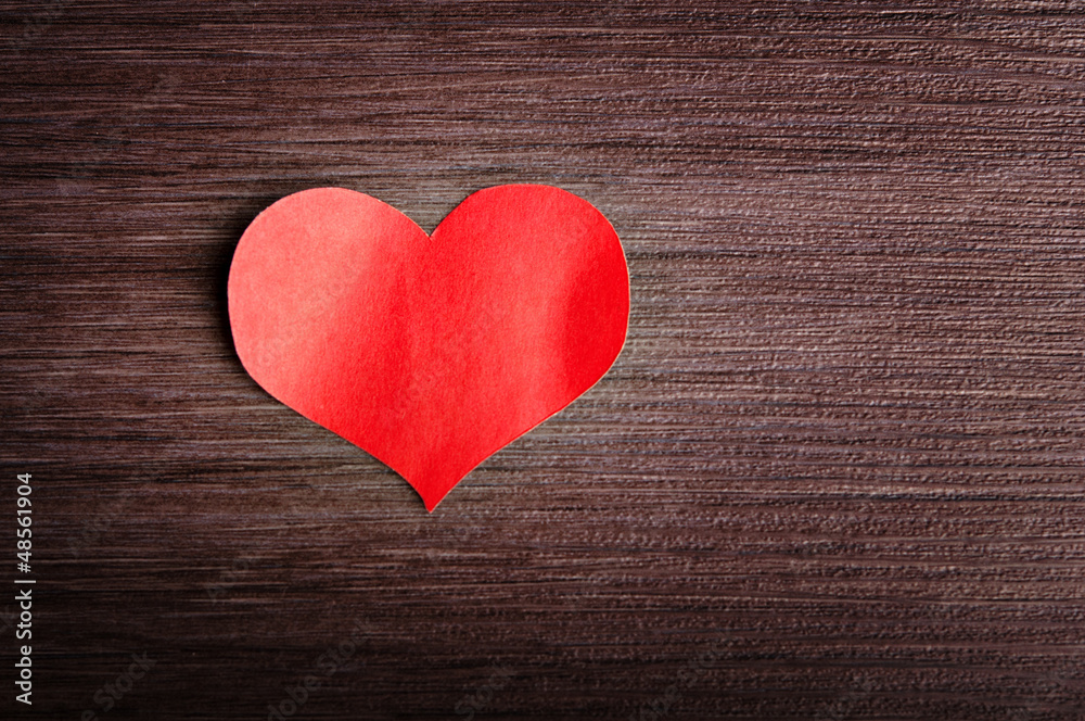 Valentines Day background. red heart on a wooden background