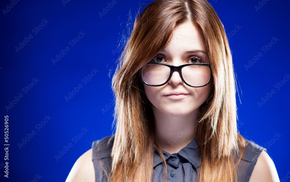 Disappointed young woman with nerd glasses, strict girl