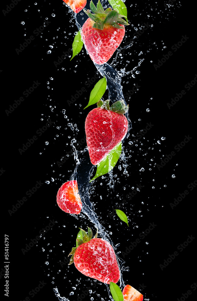 Strawberries in water splash, isolated on black background
