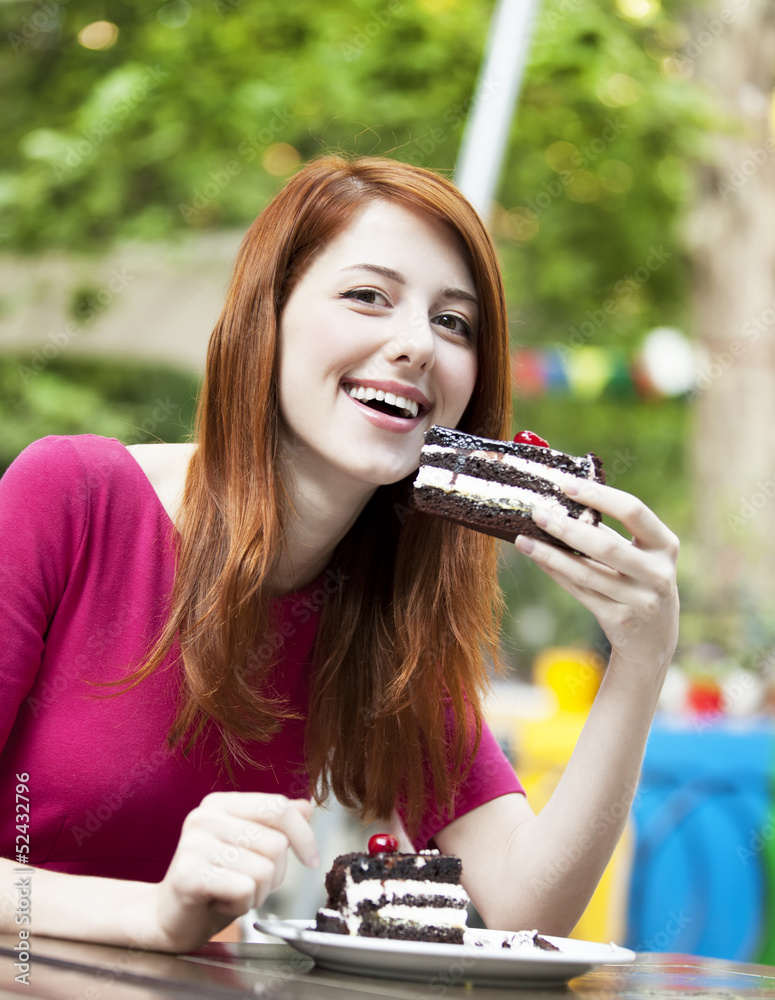 Style redhead girl with cake and cup