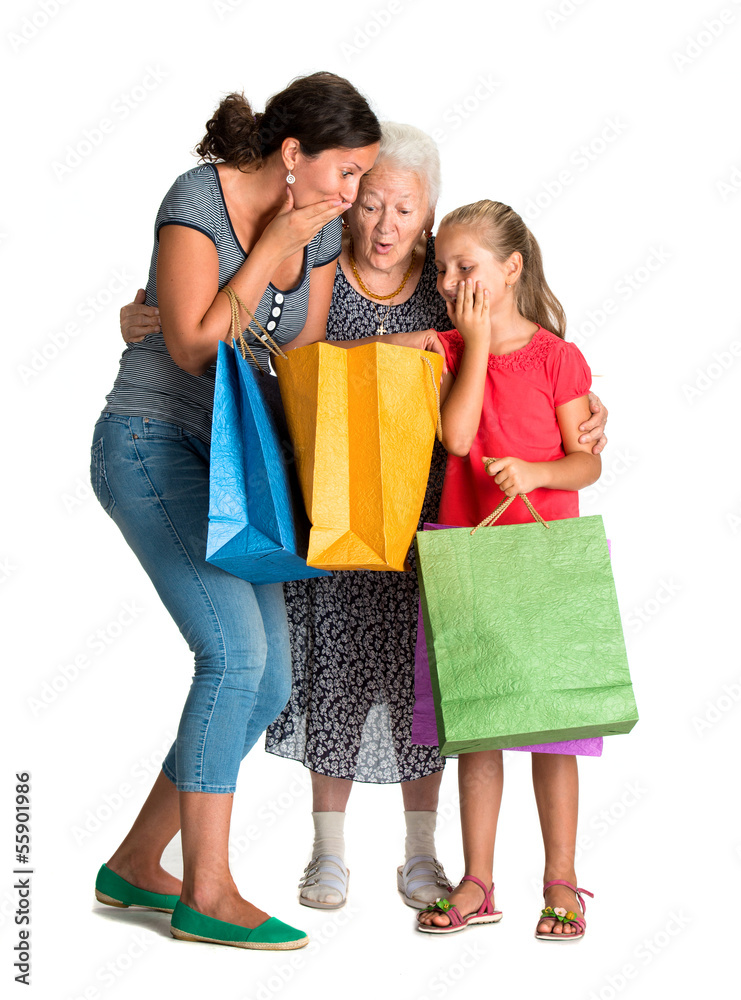 Three generations of women with shopping bags
