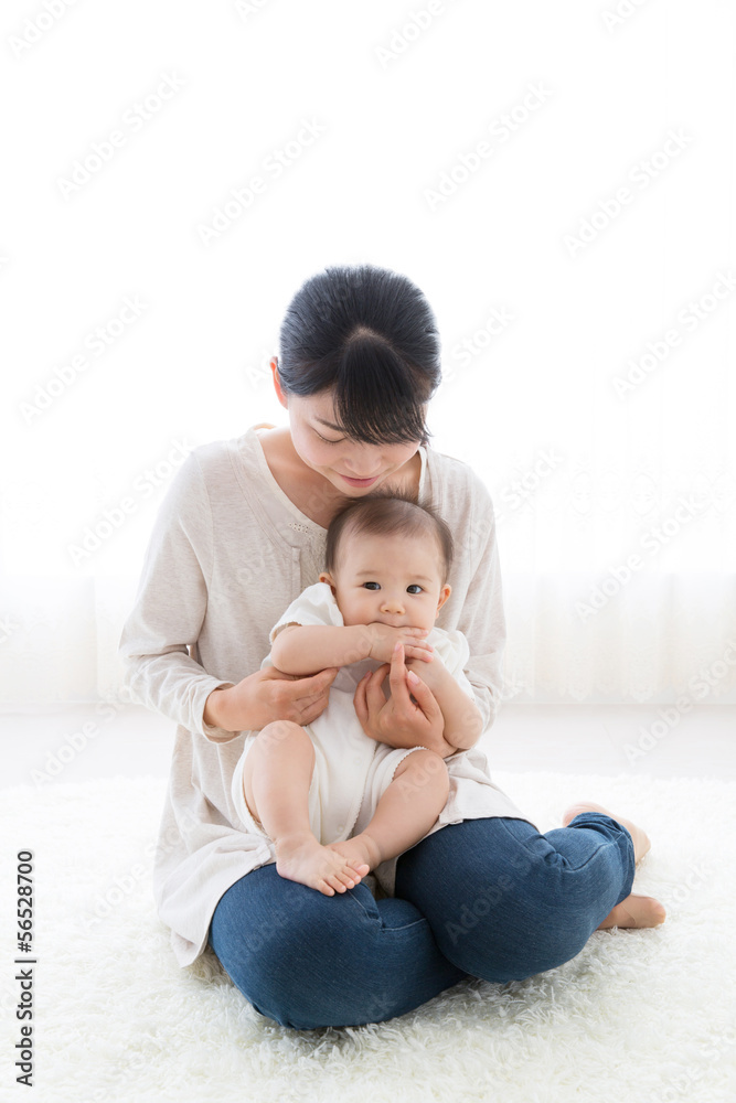 portrait of asian baby and mother relaxing