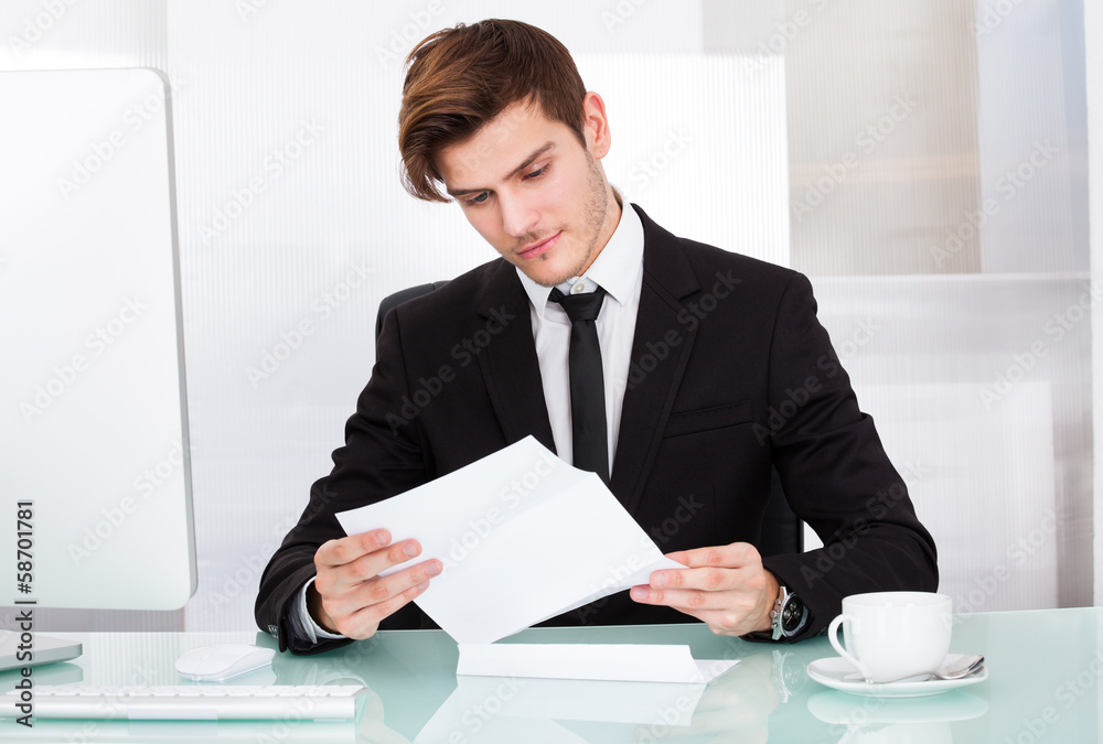 Businessman Reading Paper