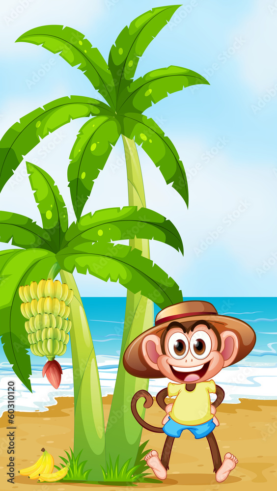 海滩上一只带着香蕉微笑的猴子