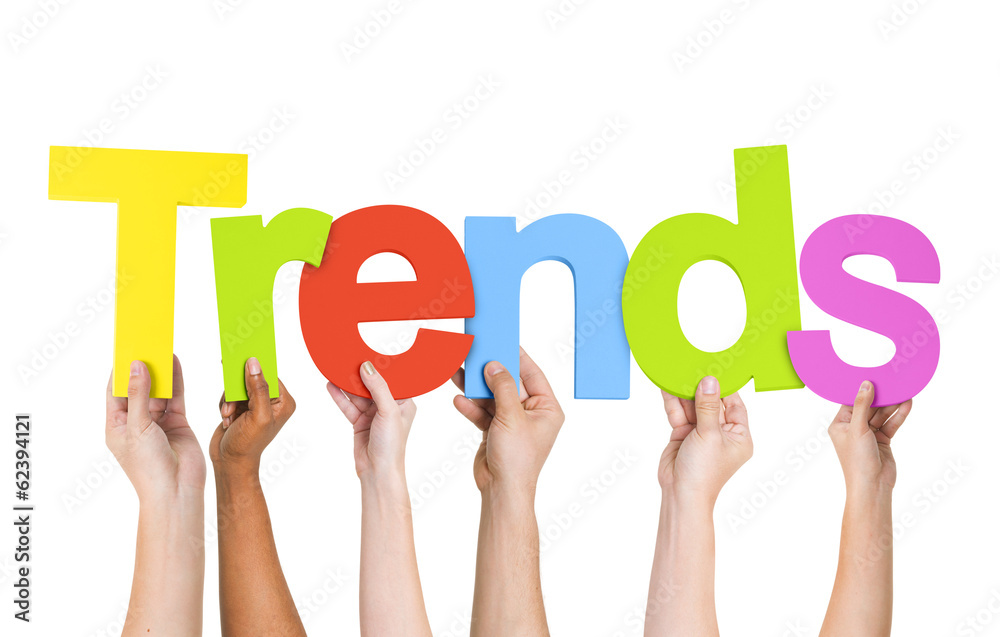Multi Ethnic People Holding The Word Trends