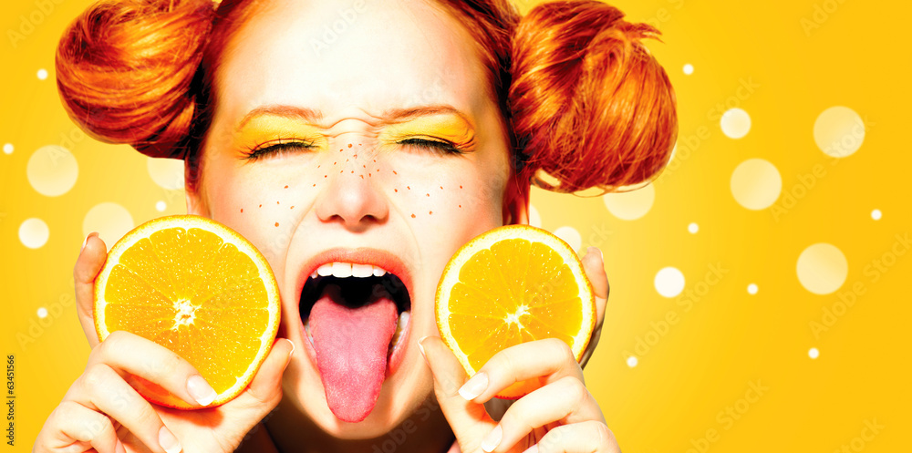 Beauty joyful teen girl with juicy oranges. Freckles