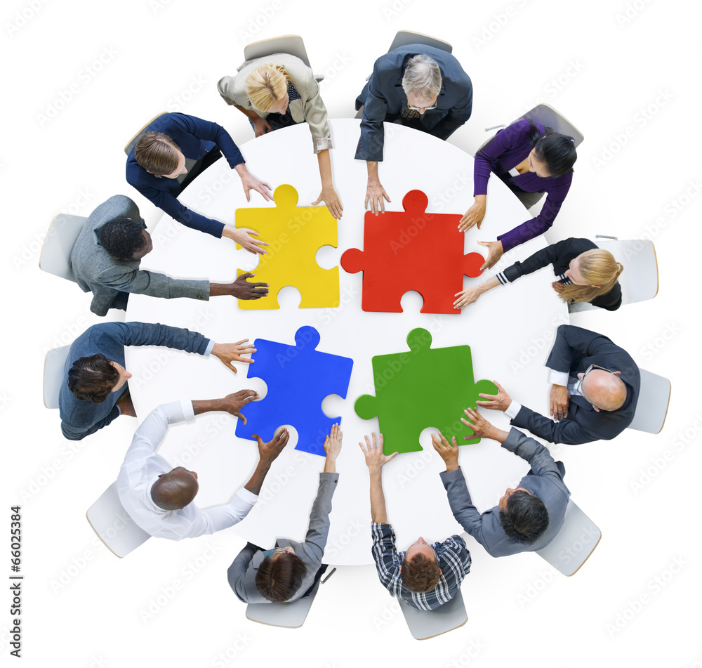 Business People with Jigsaw Puzzle and Teamwork Concept