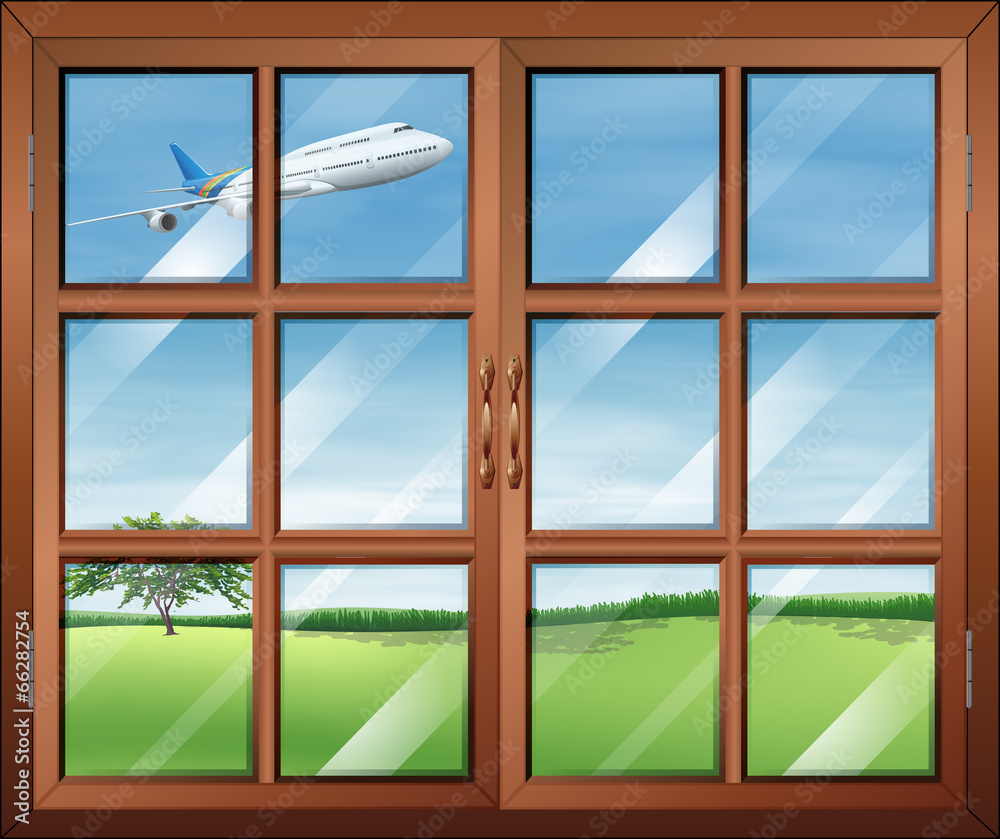 一扇可以看到天空中飞机的窗户
