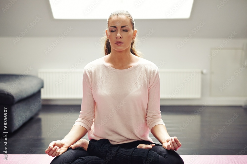 Fit young woman in meditation