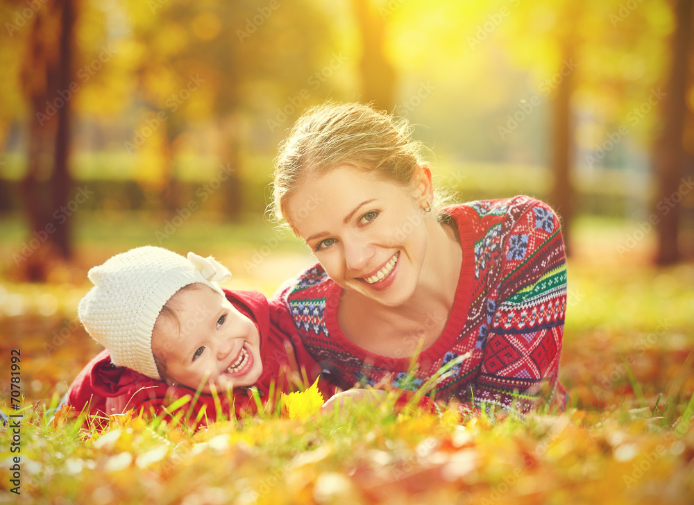 happy family: mother and child little daughter  in  autumn