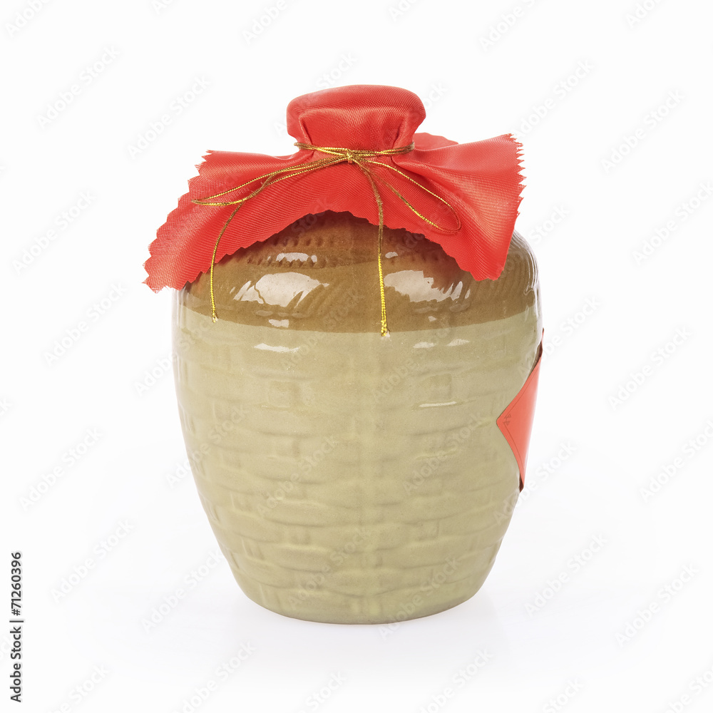 yellow rice wine jar on a white background