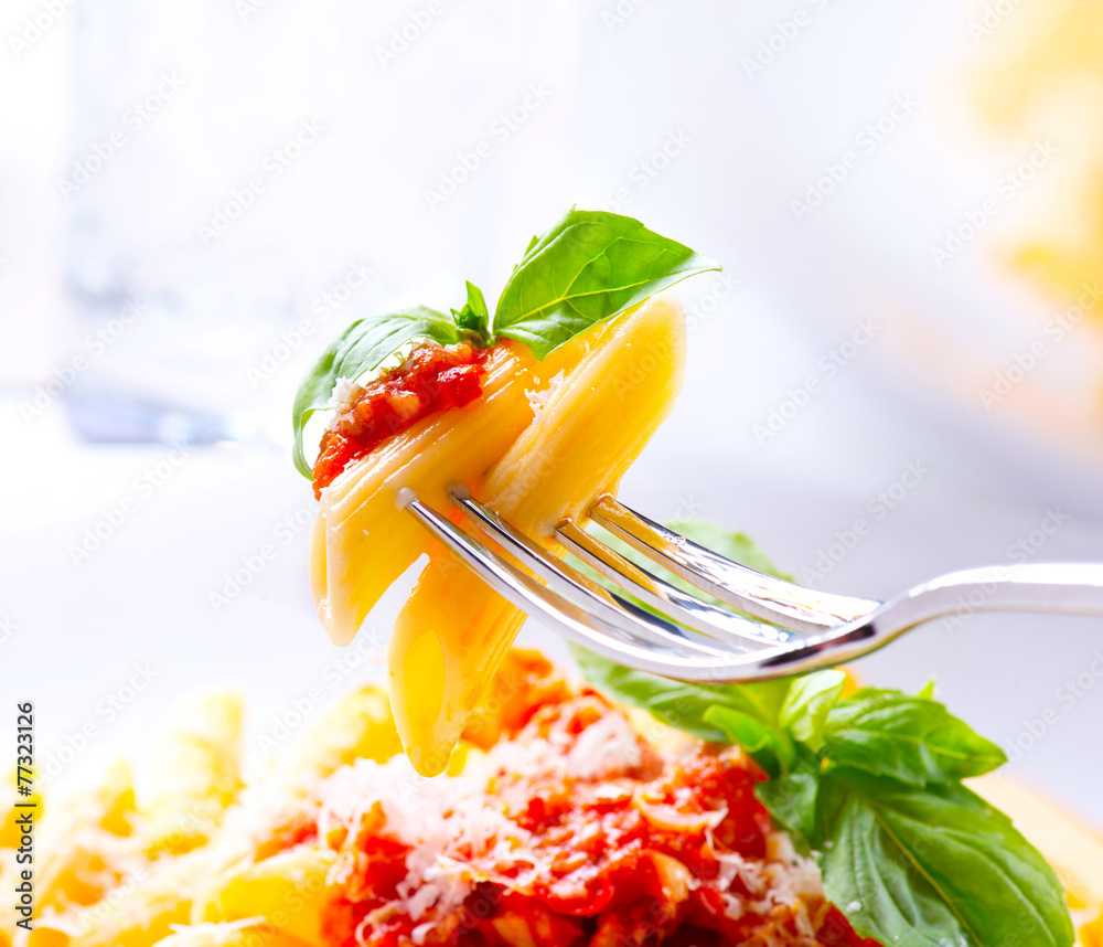 Pasta. Penne Pasta with Bolognese Sauce on a Fork