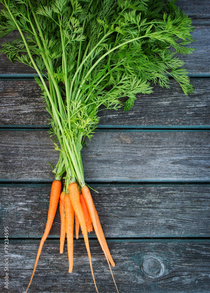 baby carrot on wooden background