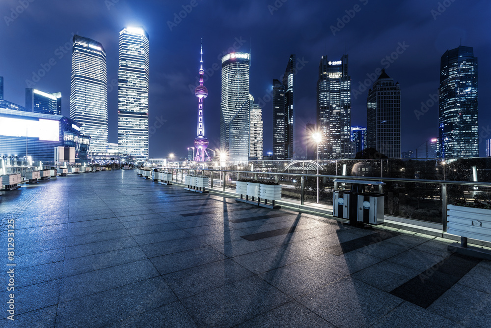 footpath and modern buildings at night