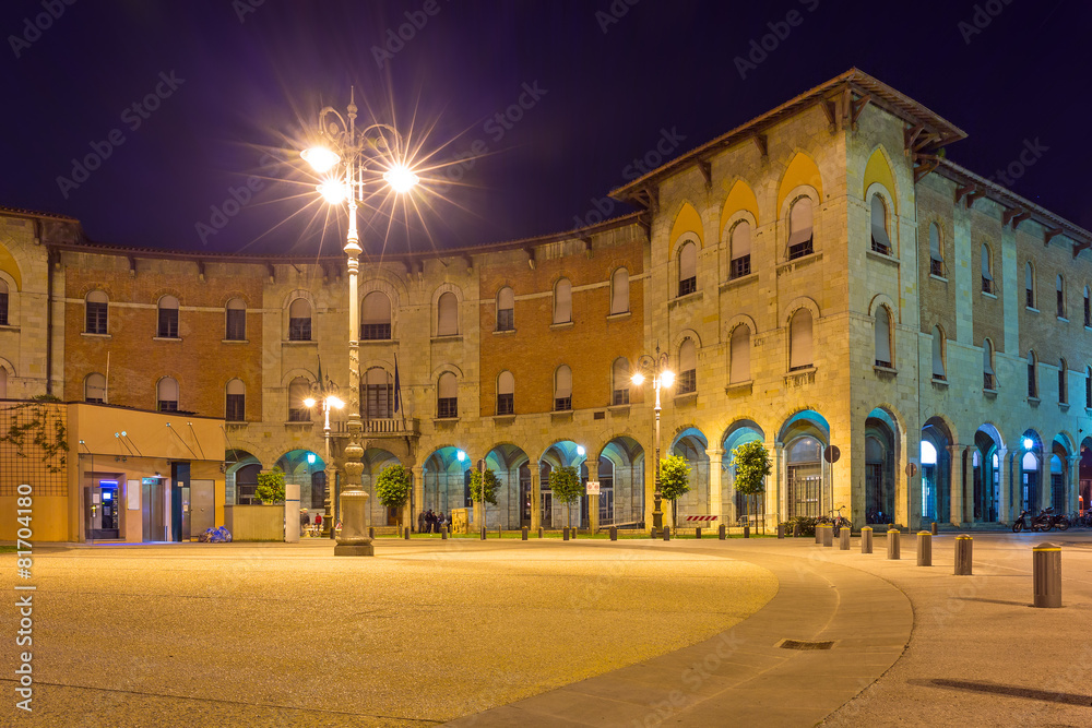 Streets of Pisa at night with traditional architecture, Italy
