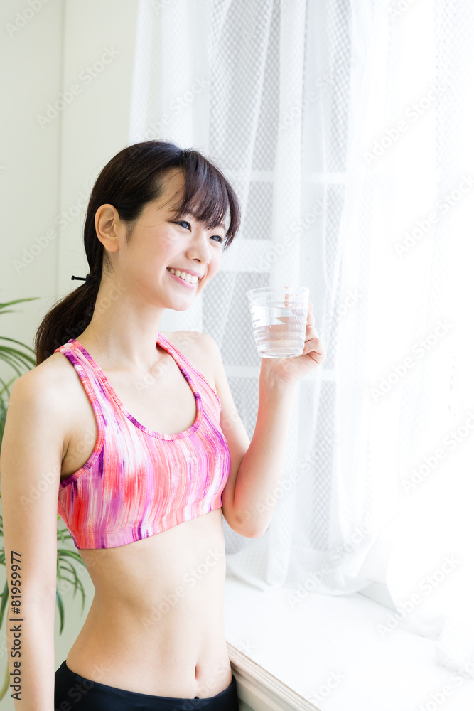 attractive asian woman drinking water